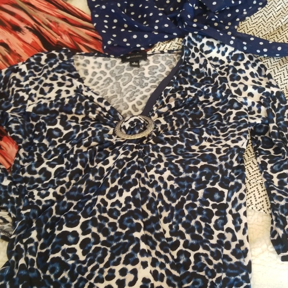 Four ladies blouses Large and XL. Come in a bundle